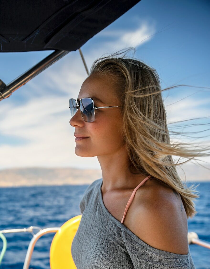 Woman Steering Sailboat